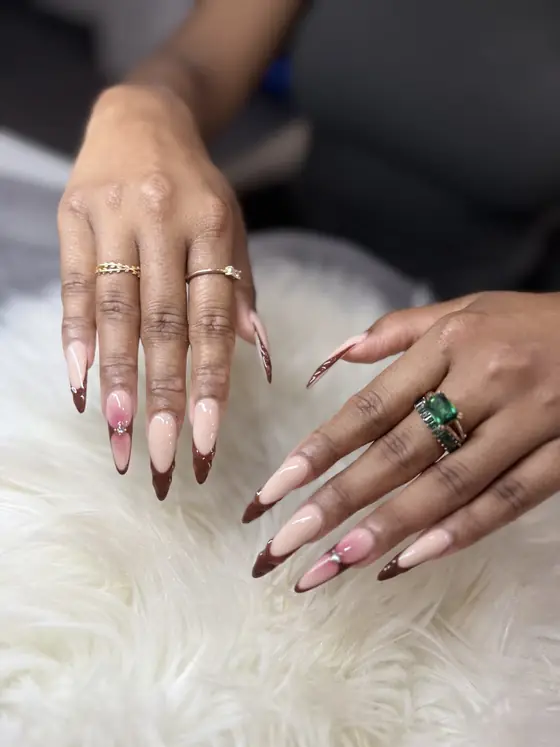 Chocolate-tip French nails done at K&J Luxury Nail Spa